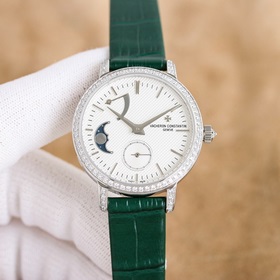 女款_江詩丹頓傳襲系列月相腕錶搭配直徑36毫米圓形白金錶殼，錶圈、錶耳和錶冠鑲嵌了總